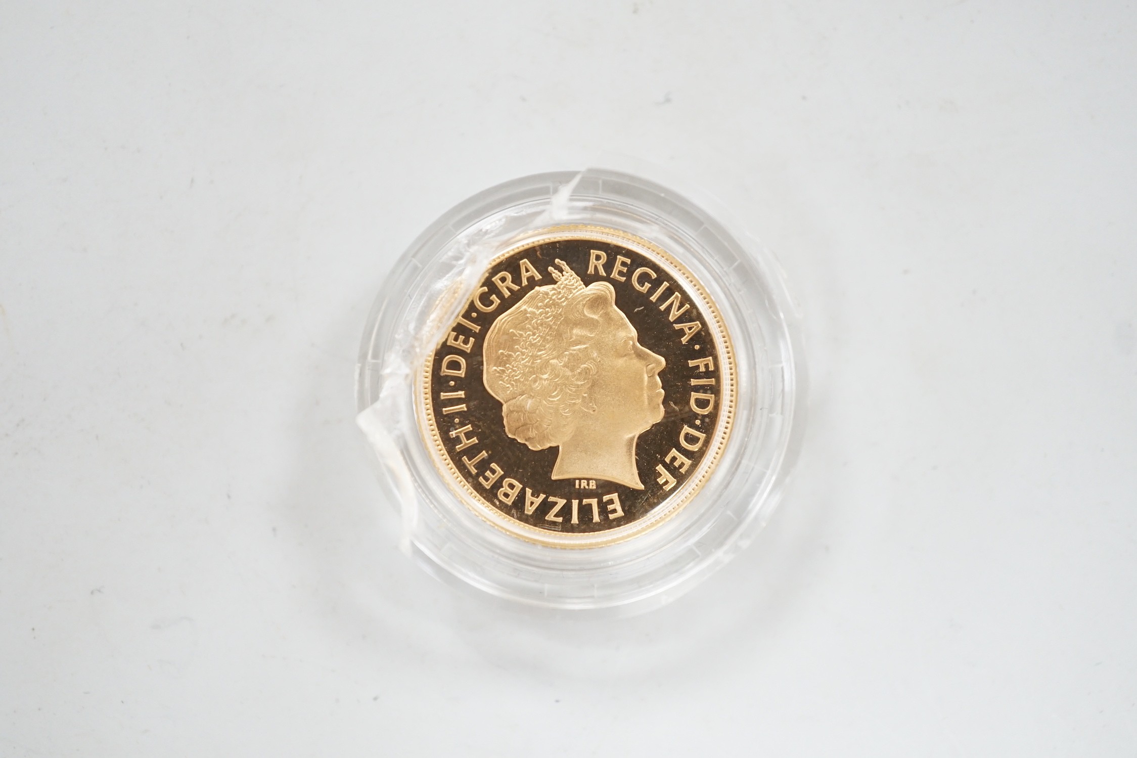 An Elizabeth II 2002 gold sovereign, in case.